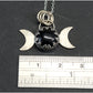 Silver triple moon pendant with gothic-styled bezel and obsidian