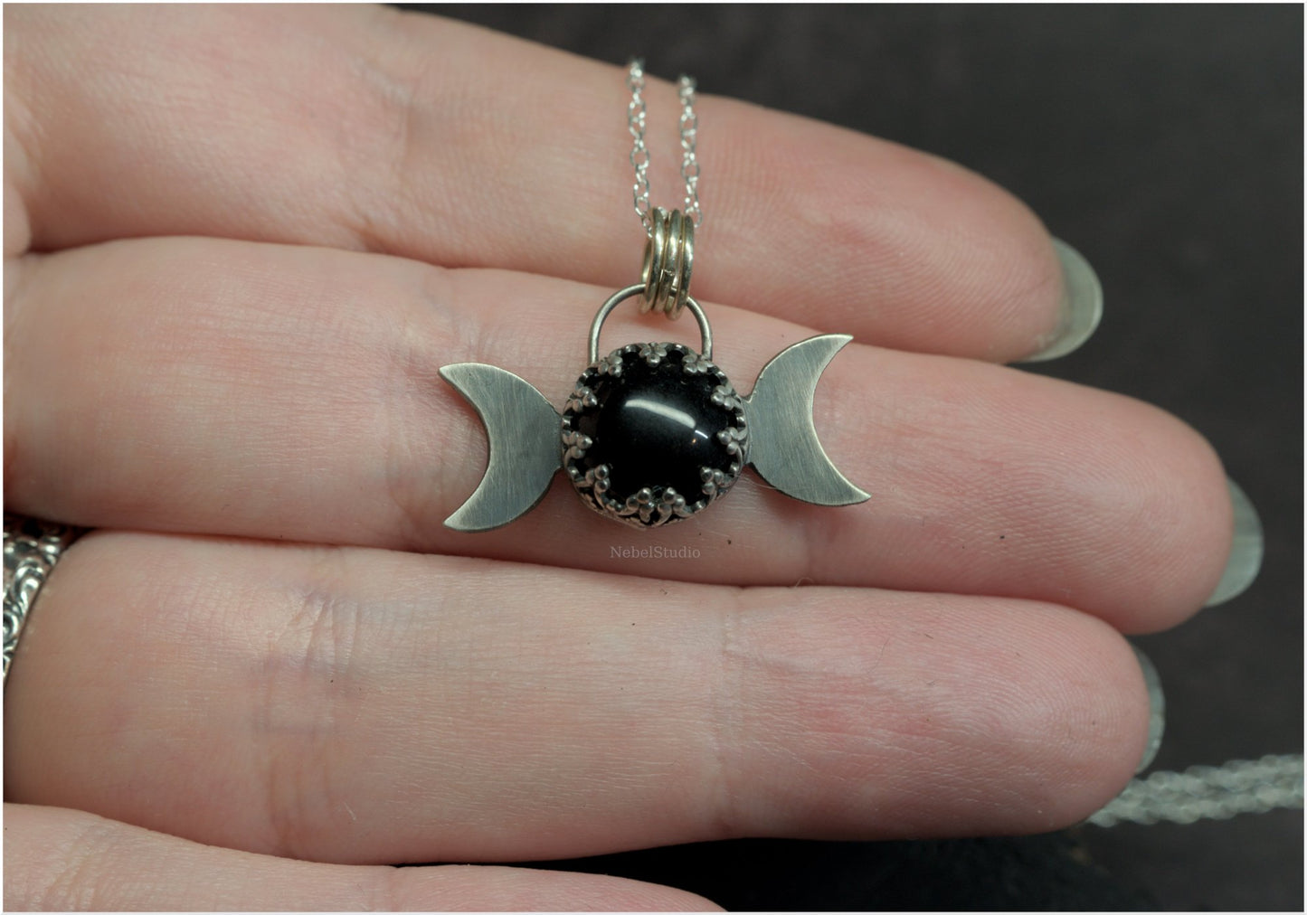 Silver triple moon pendant with gothic-styled bezel and obsidian